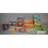 A mixed group of toys including three boxed games 'Merit Driving Test', 'Tip-It' and 'Rolo-Boko',