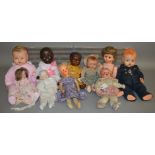 10 unboxed vintage porcelain and composition dolls including an Armand Marseille black girl doll and