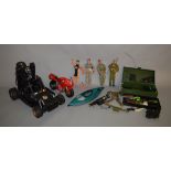 4 Action Man figures, a buggy, a motorcycle and a boat together with an Action Man trunk