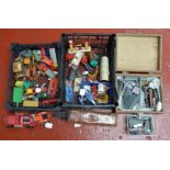 An interesting assortment of unboxed playworn vintage diecast, tinplate and plastic models by