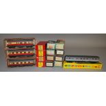 HO/OO Gauge. 3 boxed TTR Coaches, 9 Trix Wagons and three Home Colour Light Signals, also boxed,