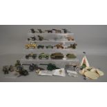 A selection of unboxed military vehciles and guns by various manufacturers including Dinky,