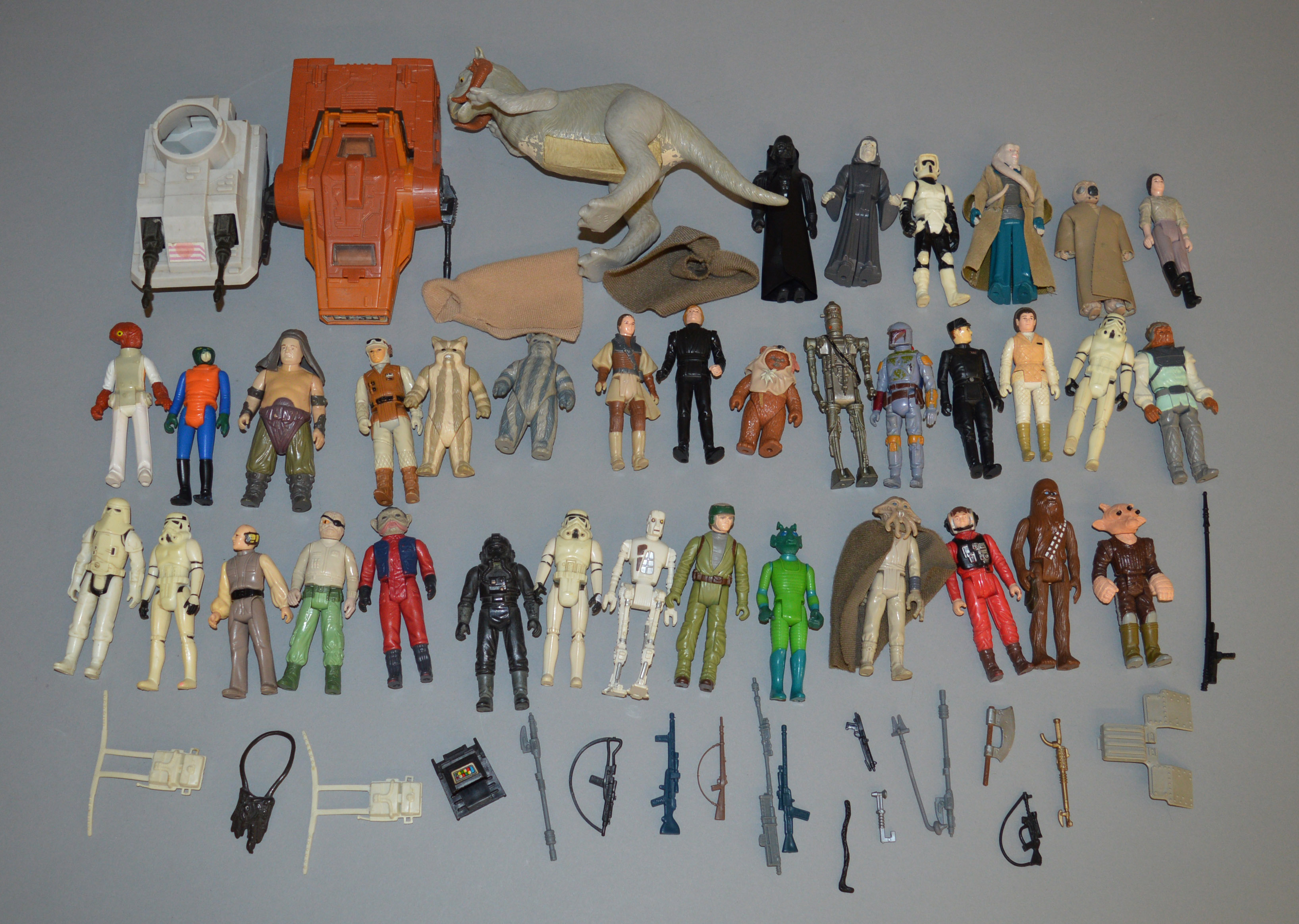 35 loose Star Wars vintage figures which includes weapons, a Taun Taun and some vehicles