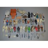 35 loose Star Wars vintage figures which includes weapons, a Taun Taun and some vehicles