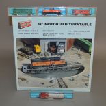 N Gauge. An Atlas 2121 Santa Fe Diesel Locomotive together with three pieces of Atlas Rolling