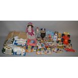 A mixed group of toys including a Corgi Racing Car carry case with models, a doll, 'Transformer'