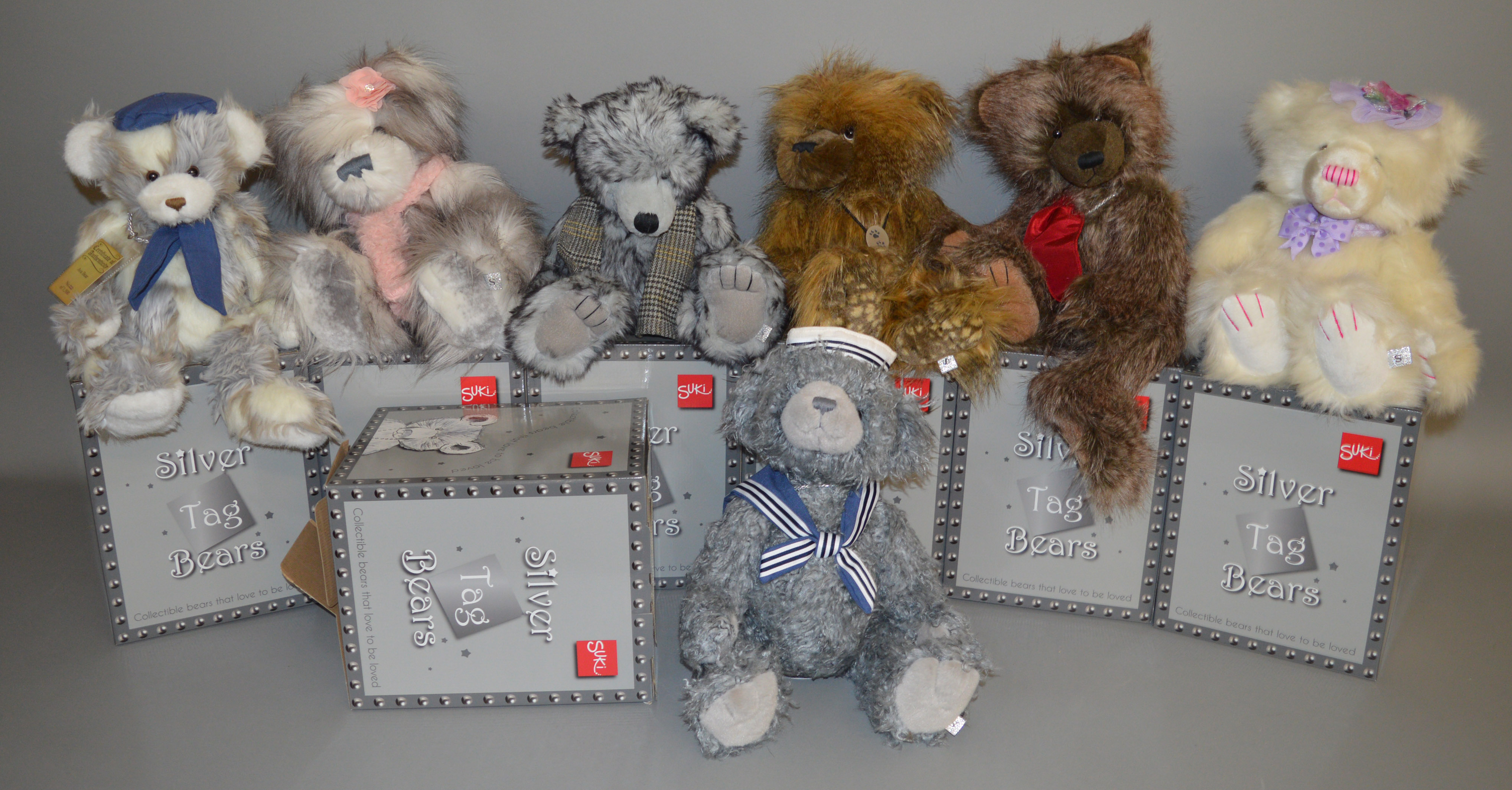 7 boxed 'Suki' Silver Tag Bears including 'Max', 'Samuel' and 'Riley', the latter bear having head