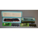 HO Gauge. A boxed Marklin 3048 Locomotive together with three Passenger Cars. 4004, 4005 and