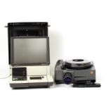 Kodak Ektapro 5000 35mm Slide Projector and a B&H Filmosound 35-767BX Daylight Projector. Carry