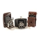 Group of Three Folding Bakelite Roll Film Cameras. Comprising two uncommon Ebner cameras (both