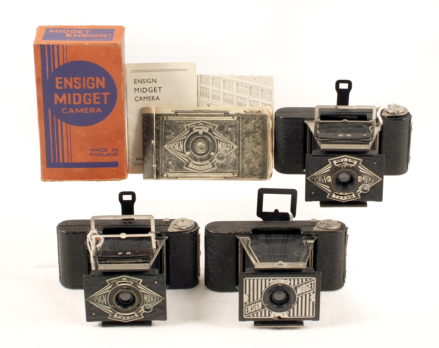 Three Ensign Midget Folding Cameras. One boxed, with Instructions etc. All with cases. (condition