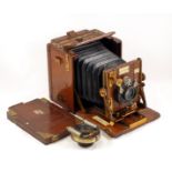 A Tropical Sanderson Hand & Stand Quarter Plate Camera. (condition 5/6F). Fitted with Ross 5 1/2