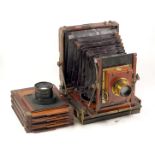 An Unnamed Wood & Brass Half Plate Field Camera With Unusual Tilting Base. (repair to front