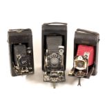 Three Folding Roll Film Cameras, One with Clockwork Motor Wind. To include a Ansco Semi Automatic,