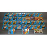 35 boxed Matchbox Superfast models, mostly in blue window box packaging with red and yellow