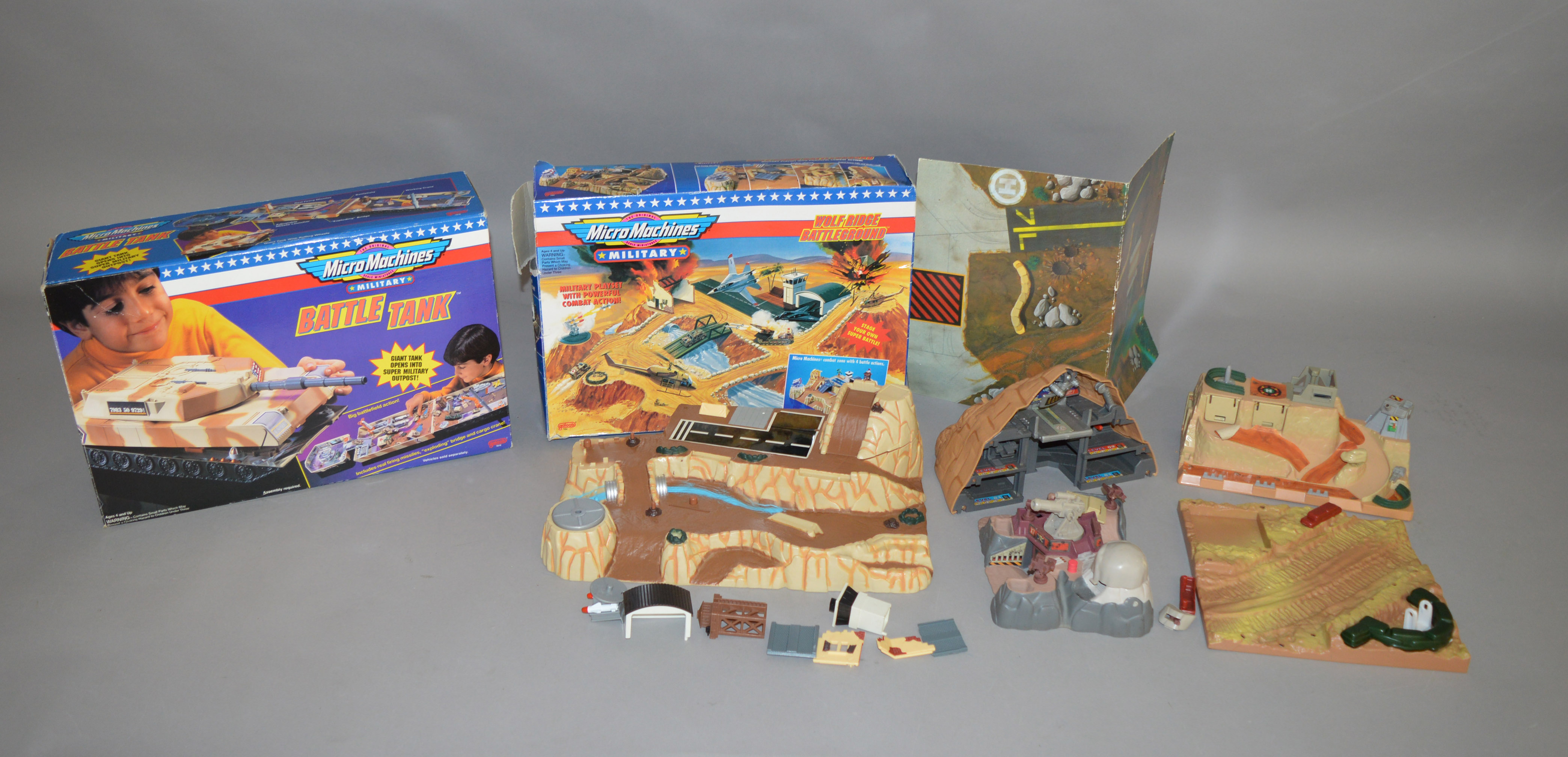 2 boxed Micro Machines sets, which includes; Wolf Ridge Battleground and Battle Tank, this lot