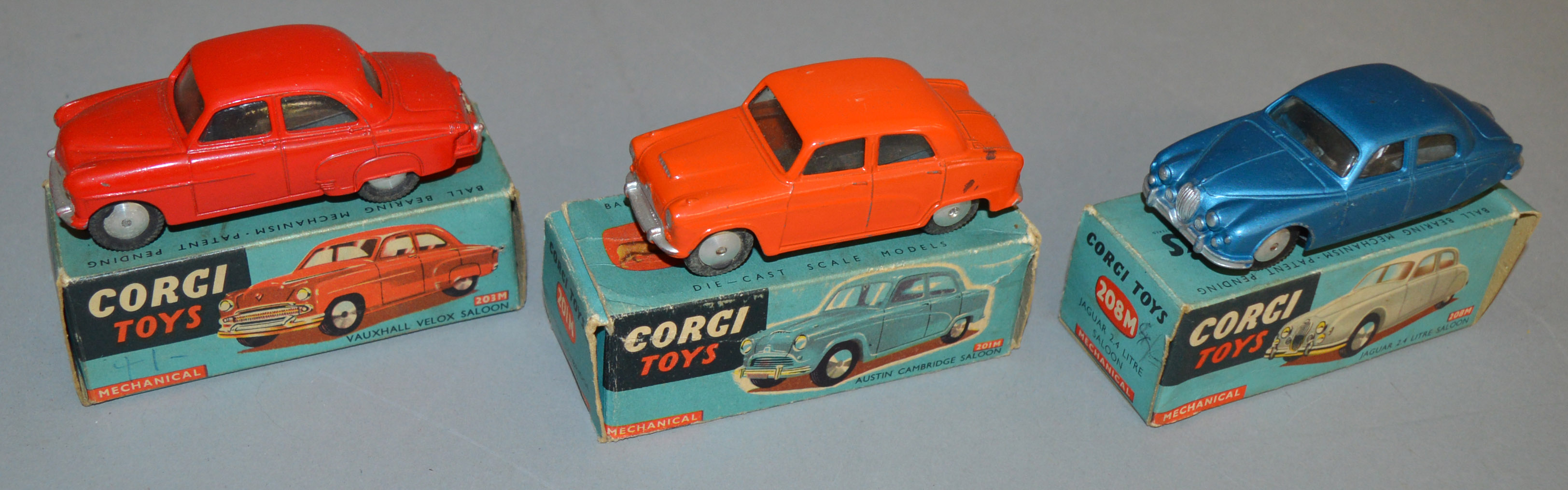 3 boxed Corgi Toys diecast model cars, all of which are mechanical versions, 201M Austin Cambridge