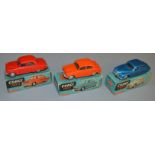 3 boxed Corgi Toys diecast model cars, all of which are mechanical versions, 201M Austin Cambridge