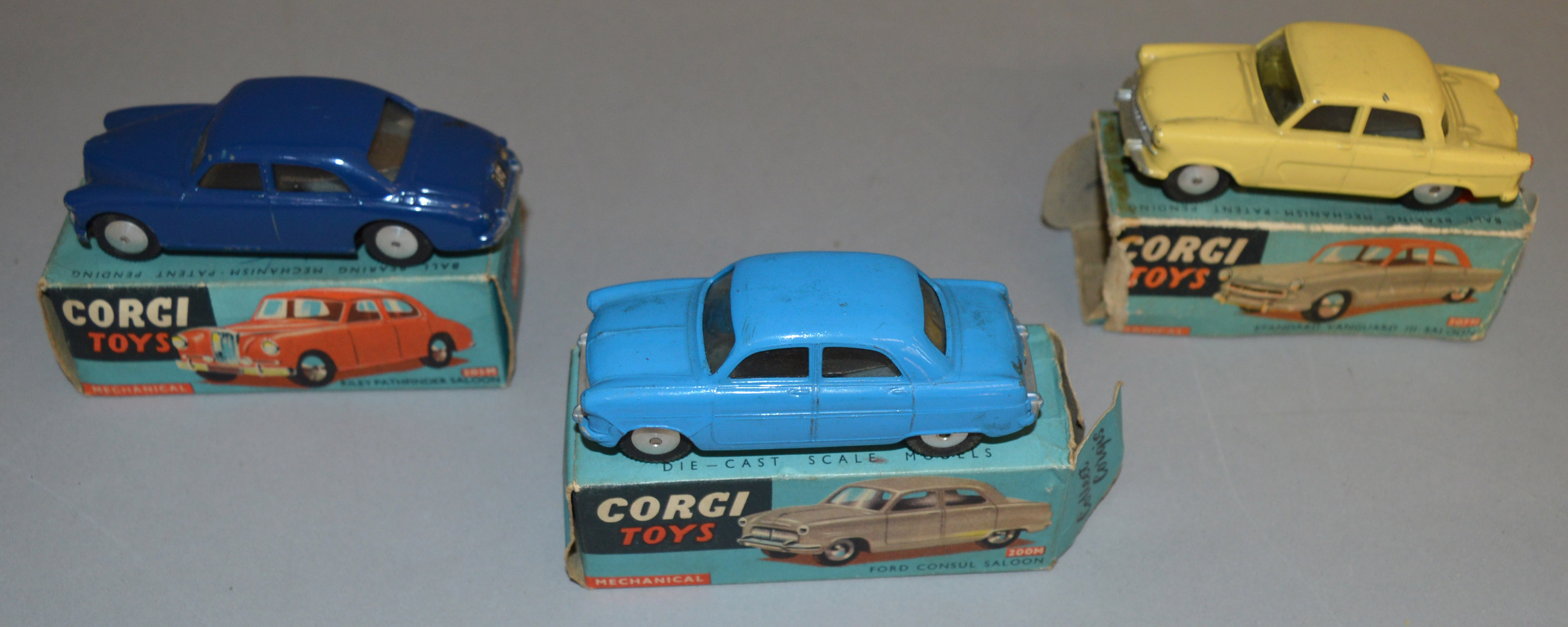 3 boxed Corgi Toys diecast model cars, all mechanical versions, including 205M Riley Pathfinder in