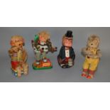 Four unboxed vintage battery operated tinplate toys including a Monkey Musician figure on