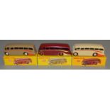 3 boxed  Dinky Toys 281 Luxury Coach models -  Maroon with cream flashes and red hubs, Fawn with