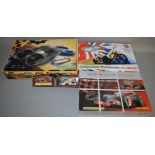 3 Scalextric boxed sets including Batman Begins etc, this set also includes 2 Scalextric cars (5).