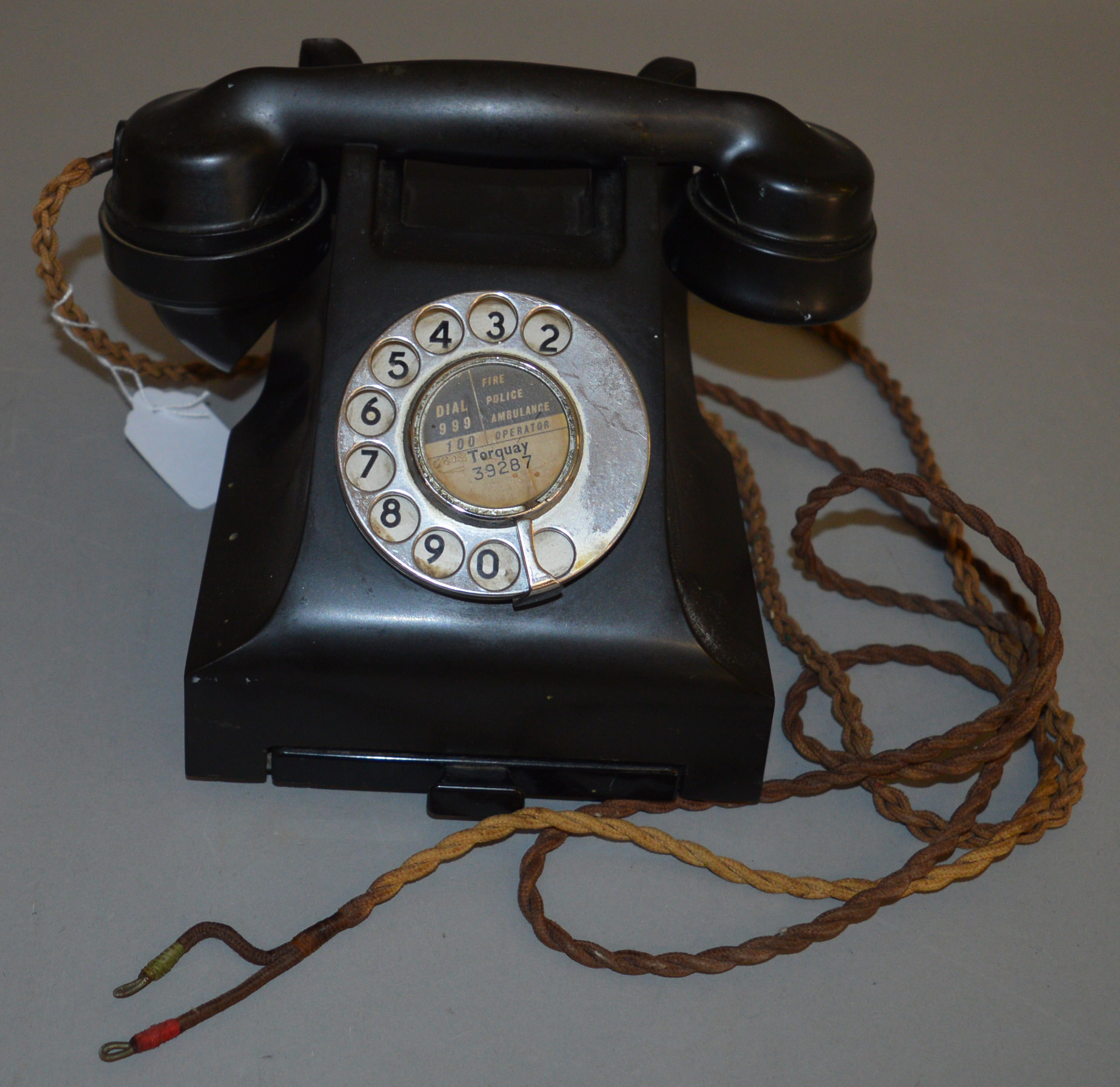 A vintage G.P.O. Bakelite Telephone, a 332L model marked FWR 59/2A, with drawer to base of phone,