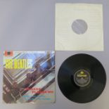 The Beatles Please Please Me mono PMC 1202 with yellow and black Parlophone label. The sleeve in