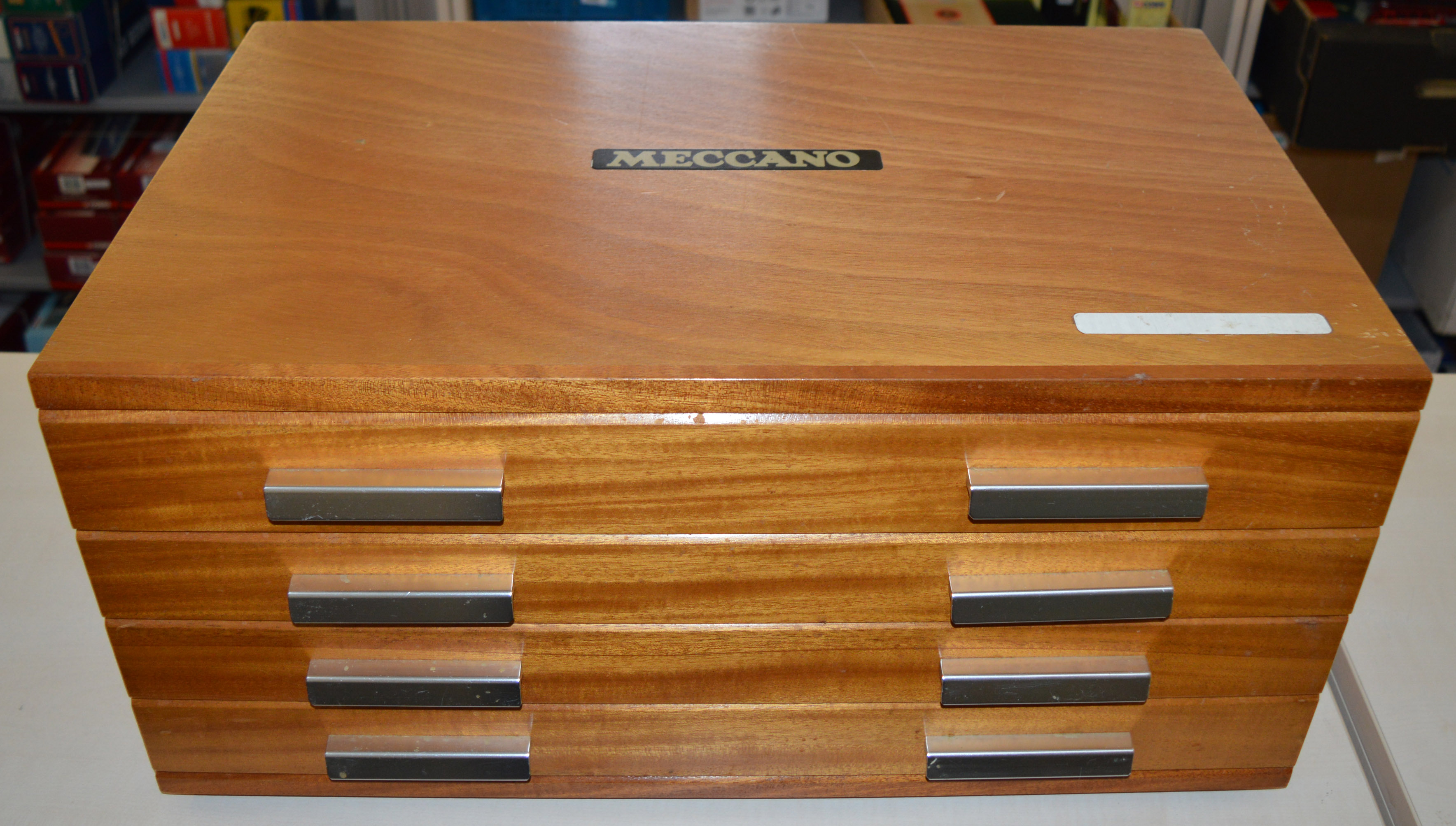 A Meccano  wooden 4 drawer Cabinet, later issue in light wood with 'Meccano' wording to top,