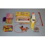 A selection of vintage toys, some boxed, including a Selcol 'Melody Maker Basket', 'Butch the Dog'