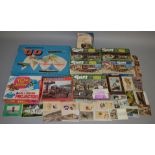 A boxed Waddington's board game 'Go - The International Travel Game' together with 7 jigsaws