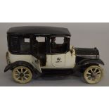 A scarce Bing German tinplate car model with two-tone black and grey finish, driver figure at the