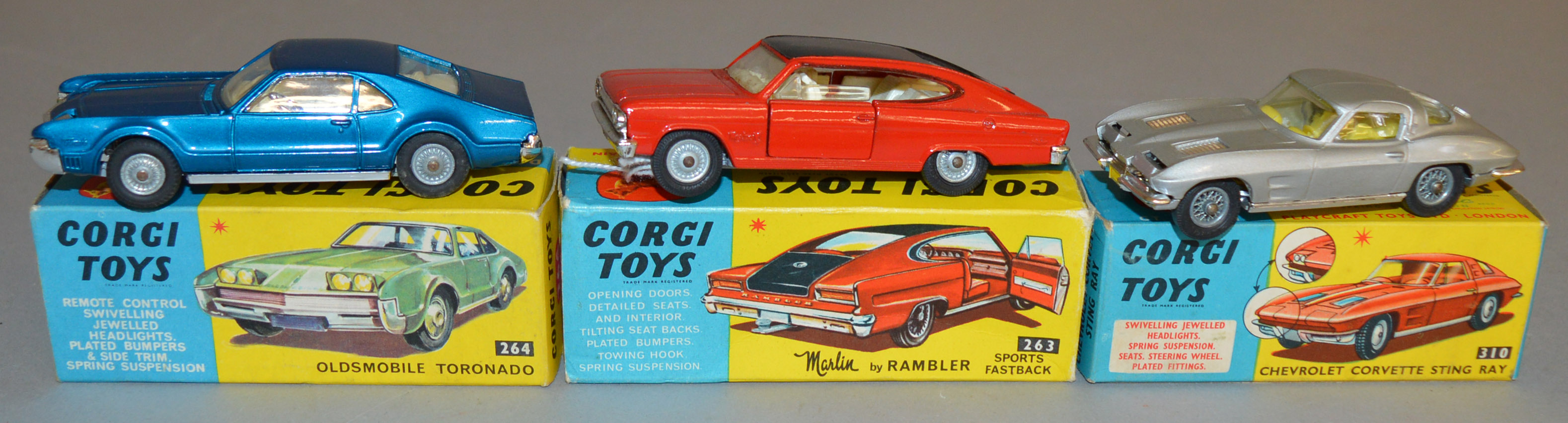 3 Corgi Toys, 263 Nash Rambler Sports Fastback in red/black, 264 Oldsmobile Tornado and 310