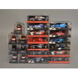 20 boxed diecast models by Minichamps, 13 Formula 1 models and 7 helmets  (20).