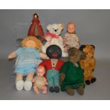 A varied selection of unboxed dolls, bears and other soft toys including a vintage straw filled bear