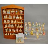 50 unboxed Cherished Teddies and similar ornaments along with a display cabinet (51).