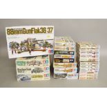 23 boxed Tamiya Military Vehicle kits and Accessory Packs mostly in 1:35 and 1/48 scales including