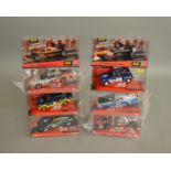 8 boxed SCX slot cars, which includes; #62060 Aston Martin DBR-9, #62680 Dodge Charger etc (8)