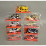 9 boxed SCX slot cars, which includes; #64320 Ford Escort MKII, #64000 Morgan Aero 8 etc (9)