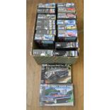 18 boxed mainly Car related Model Kits by Revell in various different scales including a 1:12