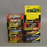 8 boxed slot car models by SCX/Scalextric, which includes some from the Vintage range; Jaguar-E "