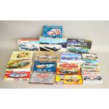 18 boxed car related plastic Model Kits by Heller, Lindberg and others in various different