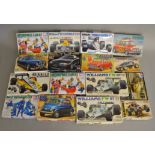 16 Car related Model Kits by Tamiya in various different scales including both Road and Race cars.