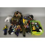 11 unboxed 'Action Man' and other similar clothed action figures together with spare outfits, a very