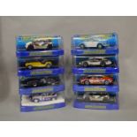 8 boxed Scalextric slot cars, which includes; #C2902 Ferrari F430 GT2 Corsa, #C3425 Caterham 7