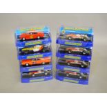 8 boxed Scalextric slot cars, which includes; #C3311 Team Lotus 49, #C3044 1969 Dodge Charger