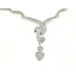 A diamond set necklace, tested 14ct white gold, the round brilliant cut diamonds total approx 4.