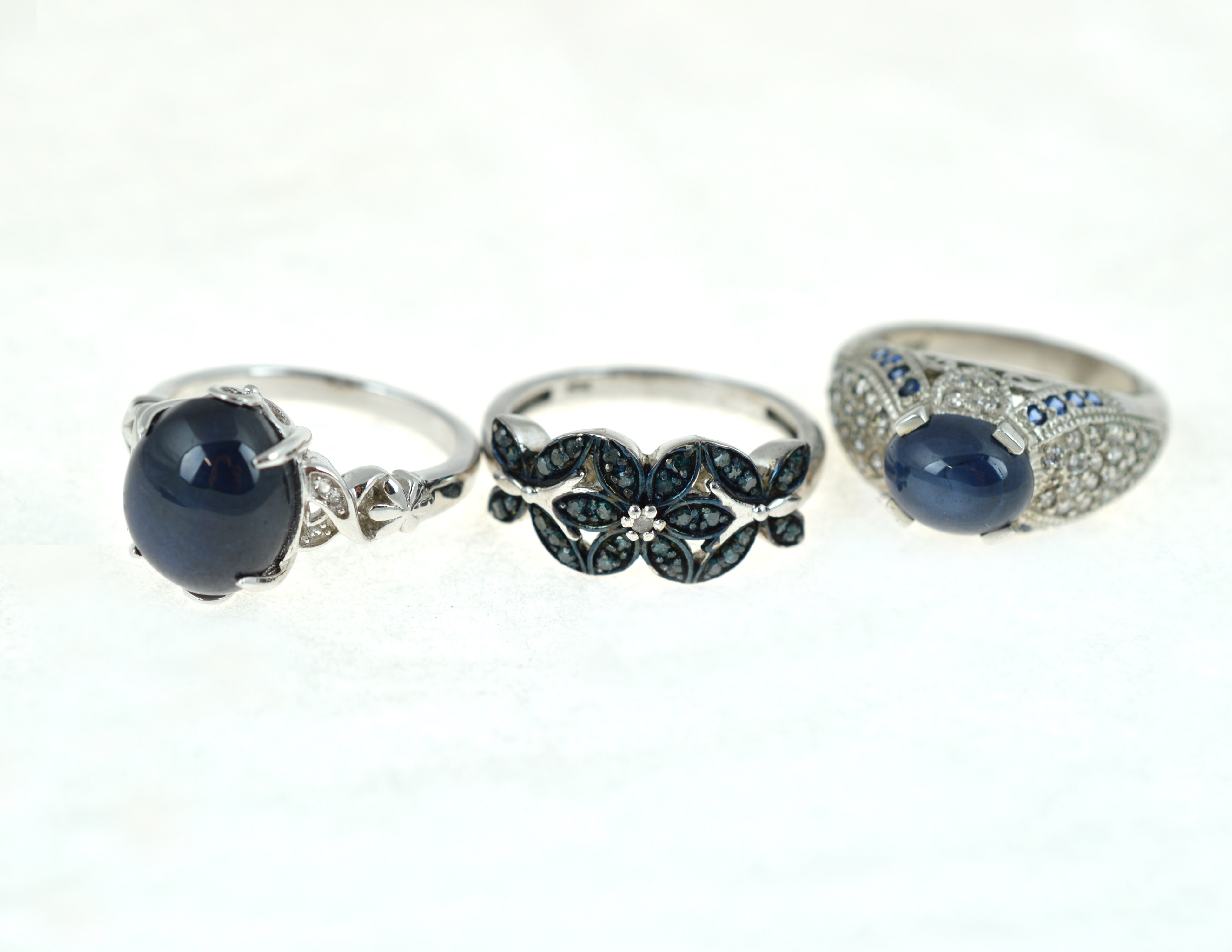 Three silver gem set rings to include one set with a Madagascan blue star sapphire & white topaz - Image 2 of 2