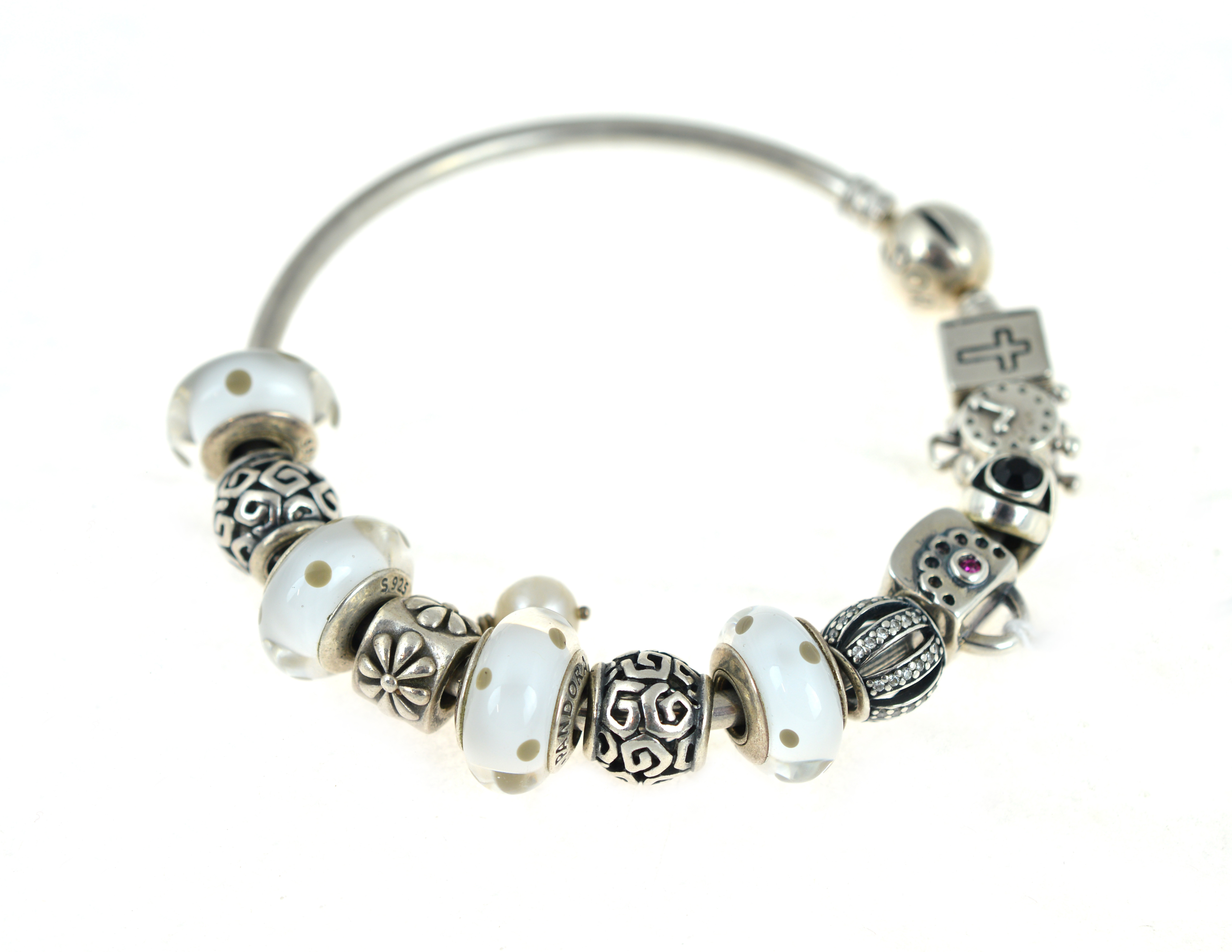 PANDORA - A silver Pandora bangle, with twelve Pandora charms, approx gross weight 43.6gms