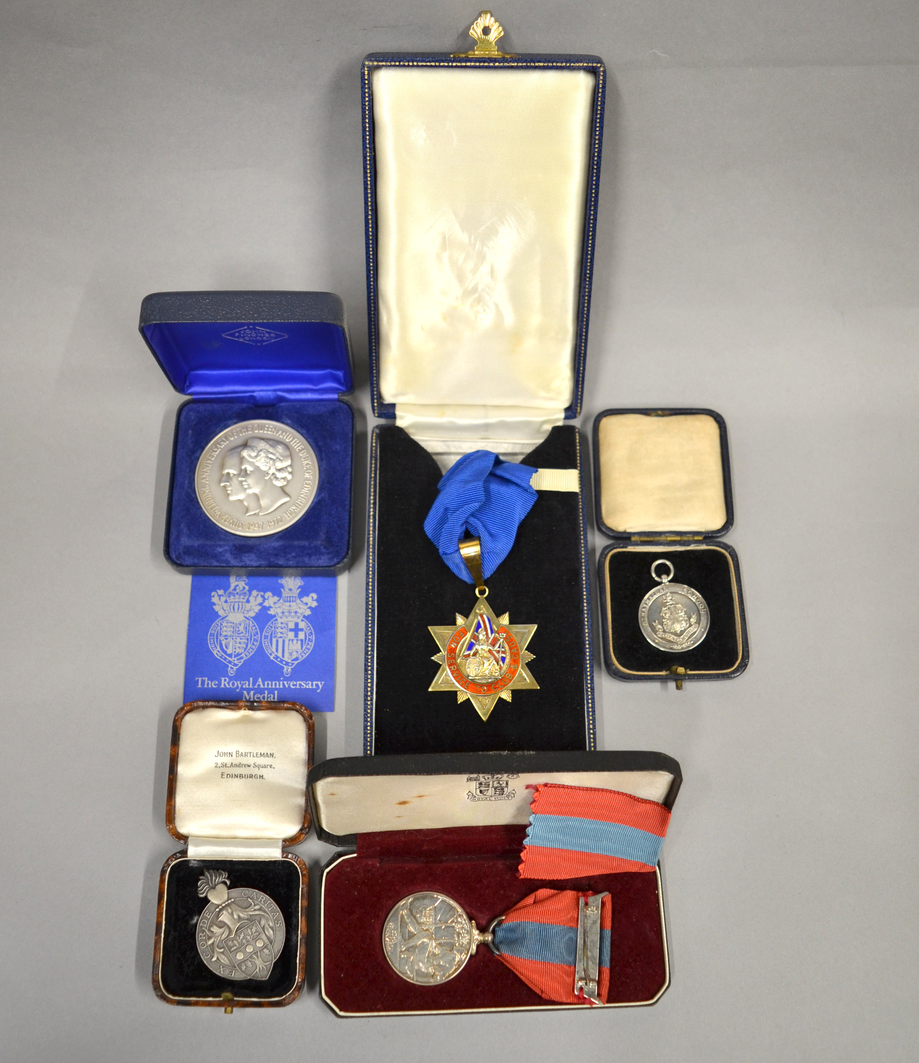 A small boxed quantity of medals to include an Imperial Service Medal in fitted case, The Royal